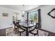 This lovely dining room features hardwood floors, a large window, and modern decor at 1240 Lone Scout Lookout, Monument, CO 80132