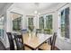 Bright dining room featuring large windows with views of the surrounding landscape at 1240 Lone Scout Lookout, Monument, CO 80132