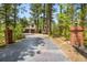 A long driveway leads up to the house with beautiful brick pillars lining the entrance at 1240 Lone Scout Lookout, Monument, CO 80132