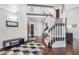 Bright entryway features hardwood floors, a staircase, and second-story overlook at 1240 Lone Scout Lookout, Monument, CO 80132
