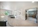 Bright hallway features neutral walls, updated lighting, and provides flow to other rooms of the home at 1240 Lone Scout Lookout, Monument, CO 80132