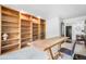Another view of the home office featuring a large desk and wall to wall built in bookshelves at 1240 Lone Scout Lookout, Monument, CO 80132