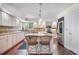 Modern kitchen features a large island with seating, stainless steel appliances, and ample cabinet space at 1240 Lone Scout Lookout, Monument, CO 80132