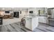 Well-equipped kitchen with stainless steel appliances, marble countertops, and an adjacent Gathering room at 1240 Lone Scout Lookout, Monument, CO 80132