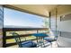 Cozy balcony with patio furniture and views of mountains in the distance at 519 Wright St # 304, Lakewood, CO 80228