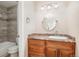 Bathroom featuring a vanity with drawers, marble countertop and an oval mirror at 519 Wright St # 304, Lakewood, CO 80228