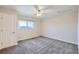 Bright bedroom featuring a ceiling fan, carpet and mountain view window at 519 Wright St # 304, Lakewood, CO 80228