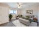 Stylishly staged bedroom featuring a ceiling fan, carpet and mountain view window at 519 Wright St # 304, Lakewood, CO 80228