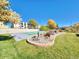 Lovely community bocce ball court next to manicured landscape in front of condo buildings on a bright sunny day at 519 Wright St # 304, Lakewood, CO 80228
