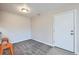 Inviting dining area with carpeting, a centered light fixture, and a white entry door at 519 Wright St # 304, Lakewood, CO 80228