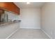 Bright dining area featuring neutral carpeting, with a serving counter and stainless refrigerator visible in the background at 519 Wright St # 304, Lakewood, CO 80228