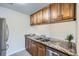 Well-equipped kitchen featuring stainless steel appliances, double sinks, and ample cabinet space at 519 Wright St # 304, Lakewood, CO 80228