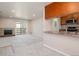 Spacious living room with a fireplace, sliding glass doors, and neutral carpeting throughout at 519 Wright St # 304, Lakewood, CO 80228