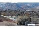 Scenic view of rolling mountains, highway traffic, and snow-covered terrain at 519 Wright St # 304, Lakewood, CO 80228