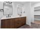 Modern bathroom featuring a double vanity with stone countertop and tile floor at 1737 Lowell Blvd, Denver, CO 80204