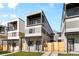 Modern townhomes featuring private balconies, fenced entries and attractive landscaping, bathed in bright natural light at 1737 Lowell Blvd, Denver, CO 80204