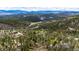 Aerial view of the community and surrounding mountains at 12346 Bear Haven Rd, Conifer, CO 80433