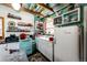 Retro kitchen design with vintage appliances and wood ceiling at 12346 Bear Haven Rd, Conifer, CO 80433