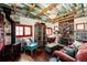 Living room showcasing a stone fireplace and unique design elements at 12346 Bear Haven Rd, Conifer, CO 80433