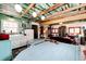 Living space featuring colorful ceiling and retro appliances at 12346 Bear Haven Rd, Conifer, CO 80433