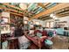Eclectic living room with a stone fireplace and unique wood ceiling at 12346 Bear Haven Rd, Conifer, CO 80433