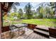Outdoor seating area with table provides relaxing outdoor living space at 12346 Bear Haven Rd, Conifer, CO 80433
