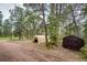Storage area with shed and temporary garage on the property at 12346 Bear Haven Rd, Conifer, CO 80433