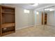 Finished basement with built-in shelving and mirrored closet at 8714 W Burgundy Dr, Littleton, CO 80123