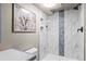 Stylish bathroom showcasing a tiled shower with built-in niches and decorative tile at 943 S Fairplay St, Aurora, CO 80012