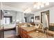 Primary bathroom with granite counters, dual sinks, and views into the main bedroom at 943 S Fairplay St, Aurora, CO 80012