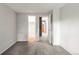 Neutral bedroom featuring grey carpet and white trim throughout at 943 S Fairplay St, Aurora, CO 80012