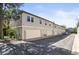 Townhome building with attached garages and well-maintained exterior at 943 S Fairplay St, Aurora, CO 80012