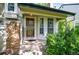 Charming front entrance with security doors and brick accents at 943 S Fairplay St, Aurora, CO 80012