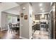 Spacious kitchen with stainless steel appliances and views into the dining area at 943 S Fairplay St, Aurora, CO 80012