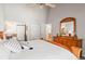 Main bedroom showcasing vaulted ceiling, an ensuite bathroom, and generous closet space at 943 S Fairplay St, Aurora, CO 80012