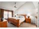 Comfortable primary bedroom with vaulted ceiling, ceiling fan and natural lighting at 943 S Fairplay St, Aurora, CO 80012