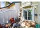 Private patio with grill and seating, accessible through sliding glass door at 943 S Fairplay St, Aurora, CO 80012