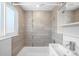 Beautiful bathroom with modern tiles, updated shower fixtures, and a sleek vanity at 3316 N Glencoe St, Denver, CO 80207