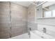 Beautiful bathroom with modern tiles, updated shower fixtures, and a sleek vanity at 3316 N Glencoe St, Denver, CO 80207
