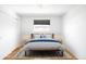 Cozy bedroom featuring a large bed with stylish bedding and ample natural light at 3316 N Glencoe St, Denver, CO 80207