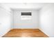 Cozy bedroom featuring ample natural light and hardwood floors at 3316 N Glencoe St, Denver, CO 80207