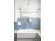 Farmhouse sink with stainless steel faucet and blue tile backsplash at 3316 N Glencoe St, Denver, CO 80207
