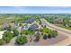 Aerial view showcases the property's location near a golf course with views, landscaping, and neighborhood at 8655 E 130Th Ave, Thornton, CO 80602