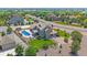 An elevated view of a home, showcasing its landscaped backyard, pool, patio, and surrounding neighborhood at 8655 E 130Th Ave, Thornton, CO 80602