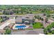Lovely aerial view of home with pool, patio area, and well-manicured lawn surrounded by mature trees at 8655 E 130Th Ave, Thornton, CO 80602