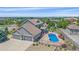 Aerial view of the property showcasing the backyard swimming pool, covered patio, and lush landscaping at 8655 E 130Th Ave, Thornton, CO 80602