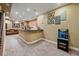 Spacious finished basement with bar area, arcade game, and comfortable seating, perfect for entertainment at 8655 E 130Th Ave, Thornton, CO 80602