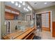 Bathroom featuring a double glass bowl vanity, modern lighting fixtures, and a walk-in shower at 8655 E 130Th Ave, Thornton, CO 80602