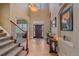 Inviting foyer with hardwood floors, staircase, and elegant decor at 8655 E 130Th Ave, Thornton, CO 80602