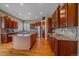 Gourmet kitchen featuring stainless steel appliances, a central island, and custom cabinetry at 8655 E 130Th Ave, Thornton, CO 80602